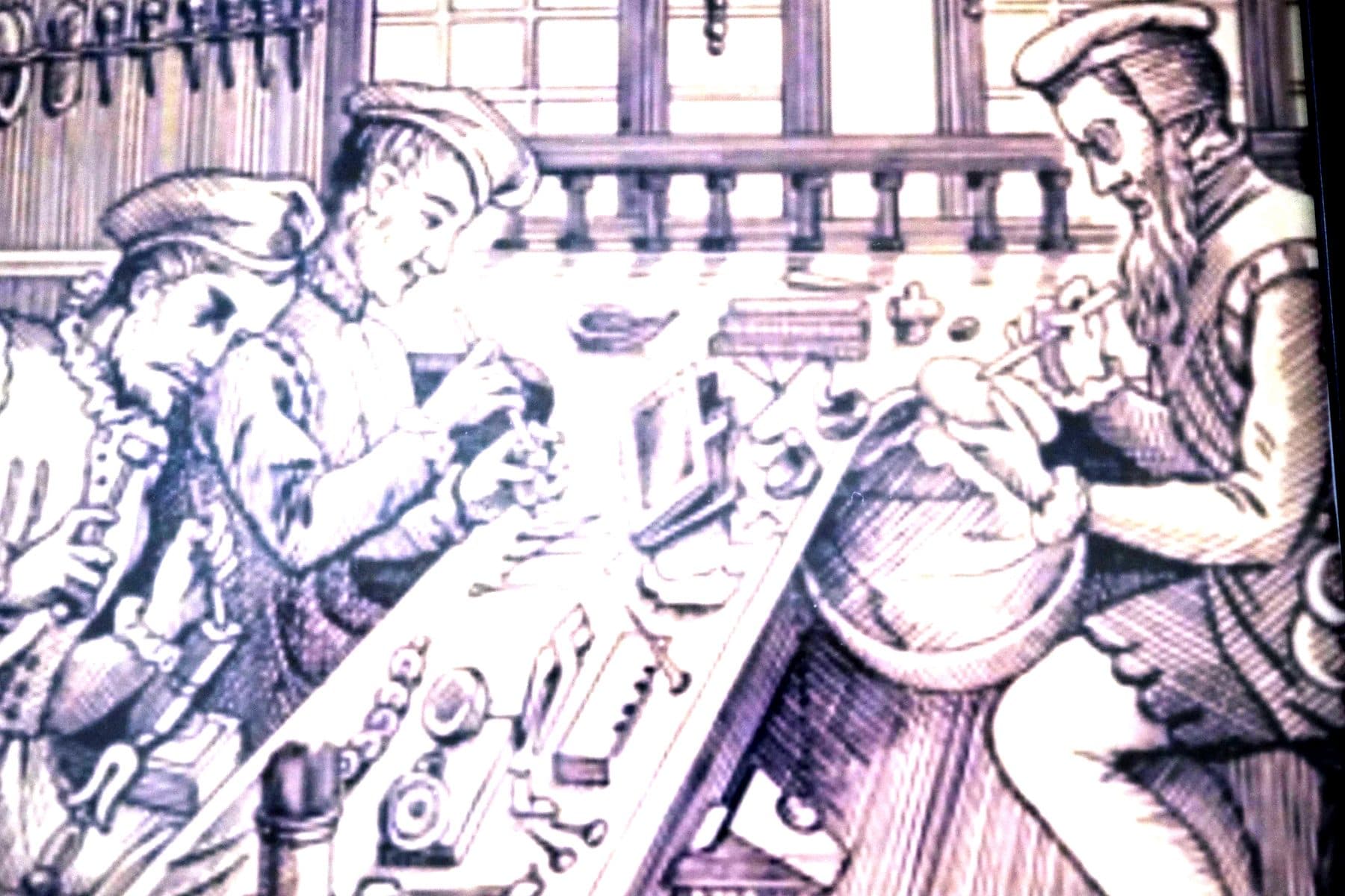 Engraving of goldsmiths at a workbench covered with small tools